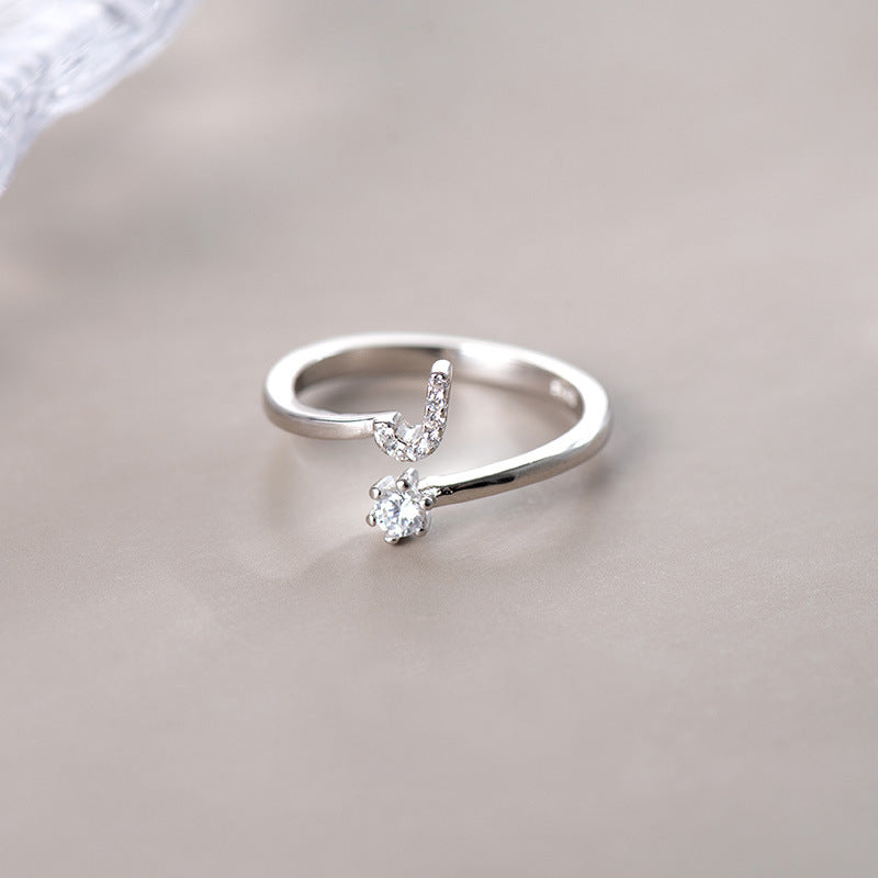 anel letra cravejada