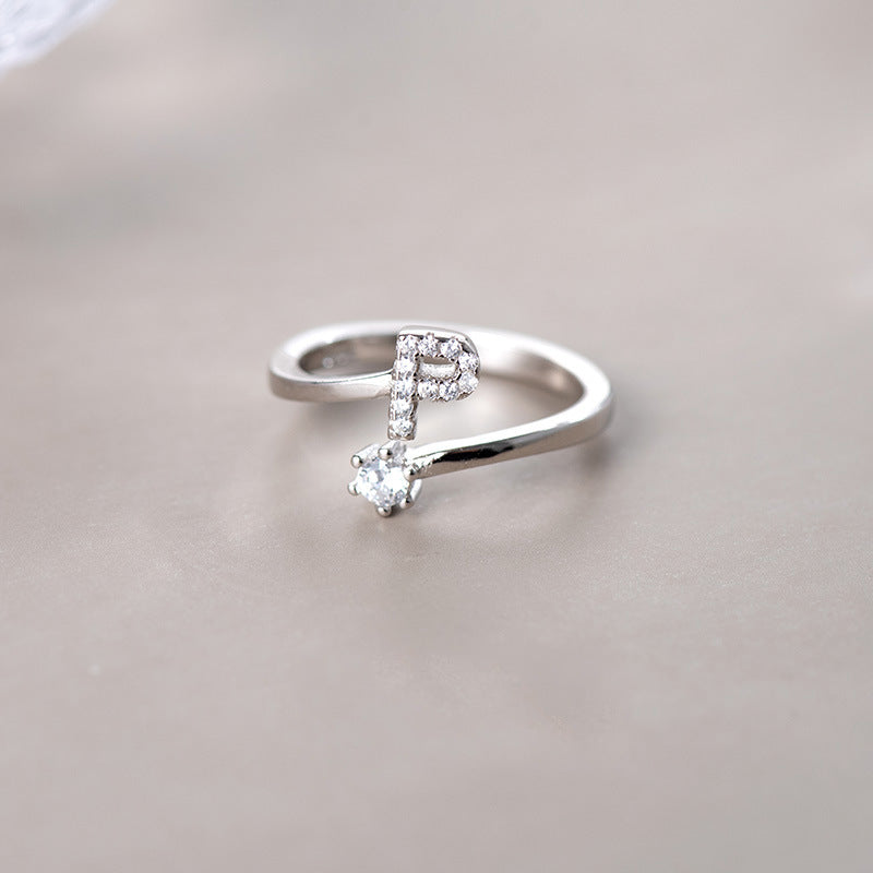 anel letra cravejada