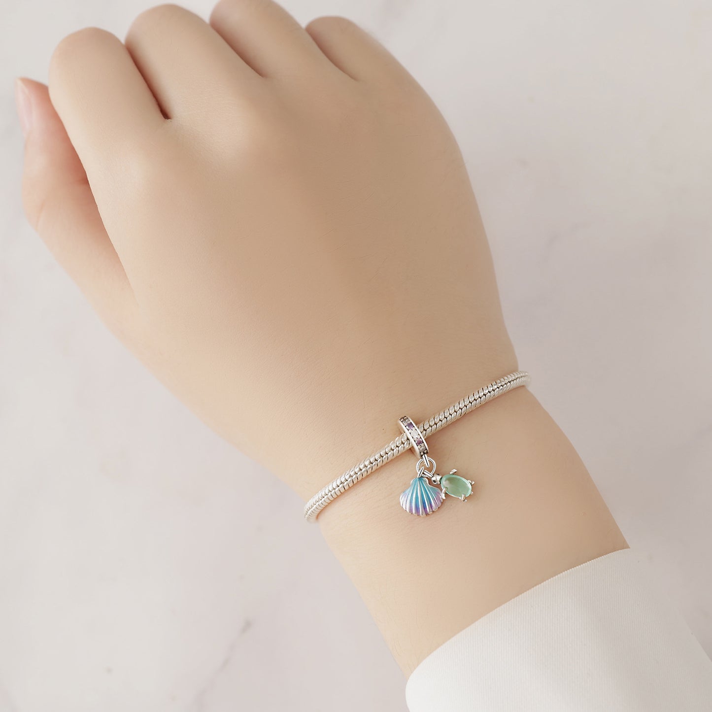 berloque tartaruga e concha mágica